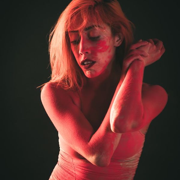 Silhouette of a person in a fluid motion pose.